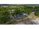 Aerial view showcasing the property's boundaries, pool, and landscaping amidst lush greenery and surrounding neighborhood at 789 Errol Pkwy, Apopka, FL 32712