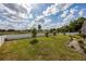 A spacious backyard features a white vinyl fence and mature trees for a private outdoor space at 789 Errol Pkwy, Apopka, FL 32712