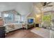 Bright bedroom featuring a full bed, desk, natural light, and hardwood floors at 789 Errol Pkwy, Apopka, FL 32712