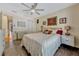 Bedroom features tile floors, a large window for natural light, and neutral decor at 789 Errol Pkwy, Apopka, FL 32712