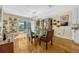 Dining room showcasing modern light fixture and sliding glass door to outdoor pool at 789 Errol Pkwy, Apopka, FL 32712