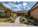 A shot of the home’s entrance with beautiful walkway and meticulous landscaping at 789 Errol Pkwy, Apopka, FL 32712