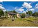 Home exterior showing the backyard, an enclosed pool area, and mature landscaping at 789 Errol Pkwy, Apopka, FL 32712