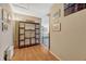 Hallway features wood floors and a decorative shelving unit with 'Gathering' sign above it at 789 Errol Pkwy, Apopka, FL 32712
