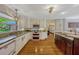 Bright kitchen features updated appliances, granite countertops, white cabinets, and wood floors at 789 Errol Pkwy, Apopka, FL 32712