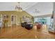 Spacious living room with fireplace, wood floors, and plenty of natural light at 789 Errol Pkwy, Apopka, FL 32712