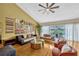 Bright living area with stylish decor, large windows, and views of the backyard pool at 789 Errol Pkwy, Apopka, FL 32712