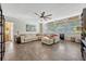 Spacious living room with tile floors, neutral walls, large sectional couch and ceiling fan at 789 Errol Pkwy, Apopka, FL 32712