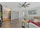 Spacious living room featuring tile floors, neutral walls, large sectional and ceiling fan at 789 Errol Pkwy, Apopka, FL 32712