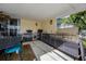 Convenient covered outdoor kitchen features a sink, storage, and grill at 789 Errol Pkwy, Apopka, FL 32712