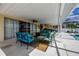 A relaxing, covered patio features comfortable seating and dining, perfect for outdoor living at 789 Errol Pkwy, Apopka, FL 32712