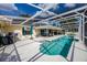 Wide view of the screened-in pool area with an attached lounging area and patio at 789 Errol Pkwy, Apopka, FL 32712