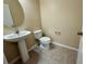 Bathroom featuring a pedestal sink, toilet, and ceramic tile flooring at 8271 Maritime Flag St # 125, Windermere, FL 34786