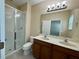 Bathroom features a double vanity, and a glass enclosed shower at 8271 Maritime Flag St # 125, Windermere, FL 34786