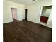 Bedroom featuring dark wood floors, adjoining bath and closet at 8271 Maritime Flag St # 125, Windermere, FL 34786