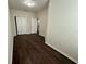 Bedroom with closet and dark wood flooring at 8271 Maritime Flag St # 125, Windermere, FL 34786