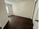 Bedroom with a window and dark wood flooring at 8271 Maritime Flag St # 125, Windermere, FL 34786
