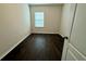 Bedroom with a window and dark wood flooring at 8271 Maritime Flag St # 125, Windermere, FL 34786