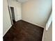 This bedroom offers dark wood floors, neutral walls, and natural light from a window at 8271 Maritime Flag St # 125, Windermere, FL 34786