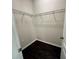 Walk-in closet with wire shelving and dark wood flooring at 8271 Maritime Flag St # 125, Windermere, FL 34786
