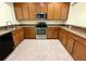 Kitchen with stainless steel appliances, ample cabinet space, and granite countertops at 8271 Maritime Flag St # 125, Windermere, FL 34786