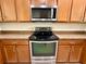 Modern kitchen showcasing stainless steel appliances and granite countertops at 8271 Maritime Flag St # 125, Windermere, FL 34786