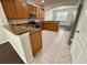 Well-lit kitchen features stainless steel appliances and open layout to the living area at 8271 Maritime Flag St # 125, Windermere, FL 34786
