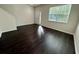 Spacious living room with wood floors and a view of the front yard at 8271 Maritime Flag St # 125, Windermere, FL 34786