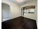 Open living area with hardwood floors and a seamless transition to the kitchen at 8271 Maritime Flag St # 125, Windermere, FL 34786