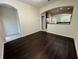 Open living area with hardwood floors and a seamless transition to the kitchen at 8271 Maritime Flag St # 125, Windermere, FL 34786