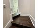 A stairway featuring hardwood steps with white trim and access to upper levels at 8271 Maritime Flag St # 125, Windermere, FL 34786