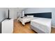 Comfortable bedroom with a queen bed and a twin bed, features wood floors and ample space at 918 Emerald Green Ct, Kissimmee, FL 34746