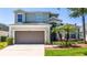 Charming two-story home features a two-car garage, well-maintained landscaping, and a welcoming entrance at 918 Emerald Green Ct, Kissimmee, FL 34746