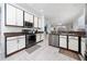Modern kitchen boasts white cabinets, stainless steel appliances, and granite countertops, perfect for culinary enthusiasts at 918 Emerald Green Ct, Kissimmee, FL 34746