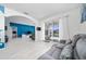 Bright living space with tile floors and an easy transition to the outdoor pool area, promoting indoor/outdoor living at 918 Emerald Green Ct, Kissimmee, FL 34746