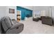 Comfortable living area features tile floors, modern decor, and ample seating, creating a cozy and stylish atmosphere at 918 Emerald Green Ct, Kissimmee, FL 34746