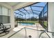 Screened-in pool area with outdoor seating at 918 Emerald Green Ct, Kissimmee, FL 34746