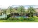 Private backyard oasis featuring a sparkling swimming pool, spa, screened enclosure, and lush landscaping at 9895 Winnington St, Orlando, FL 32832