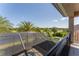 Balcony overlooking pool, golf course, and the surrounding neighborhood and landscape at 9895 Winnington St, Orlando, FL 32832