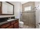 Bathroom boasts a granite countertop vanity and a glass-enclosed tiled shower at 9895 Winnington St, Orlando, FL 32832