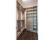 Inside a custom designed walk-in closet at 9895 Winnington St, Orlando, FL 32832