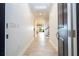 Bright foyer with wood-look tile floors, recessed lighting, and a view into the open floor plan at 9895 Winnington St, Orlando, FL 32832