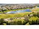 Scenic view of a golf course and water feature surrounded by lush landscaping and residential homes at 9895 Winnington St, Orlando, FL 32832