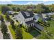Picturesque aerial view of a home featuring a well-kept lawn, lush landscaping, and a charming neighborhood at 1114 Georgia Blvd, Orlando, FL 32803