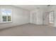 Spacious bedroom with neutral carpet, a shuttered window and two doors with contrasting hardware at 1114 Georgia Blvd, Orlando, FL 32803