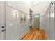 Light-filled foyer with hardwood floors, white wainscoting, and a built-in storage bench at 1114 Georgia Blvd, Orlando, FL 32803