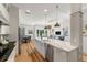 Bright open kitchen with island seating and stainless steel appliances at 1114 Georgia Blvd, Orlando, FL 32803