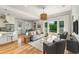 Bright living room with wood floors and sliding glass doors leading to a pool at 1114 Georgia Blvd, Orlando, FL 32803