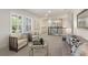 Cozy upstairs living area with plush seating, shutters, and a view of the stairwell at 1114 Georgia Blvd, Orlando, FL 32803