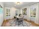 Bright office featuring a modern desk, hardwood floors, large windows, and stylish decor at 1114 Georgia Blvd, Orlando, FL 32803